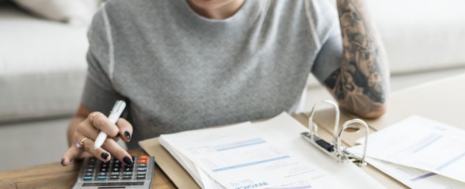 Caucasian woman with invoice bills