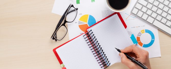 Woman working with reports and charts
